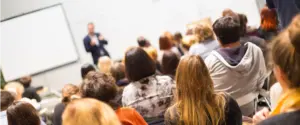 Enda O'Doherty corporate keynote speaker delivering high impact leadership talk to large audience at major Irish corporate conference