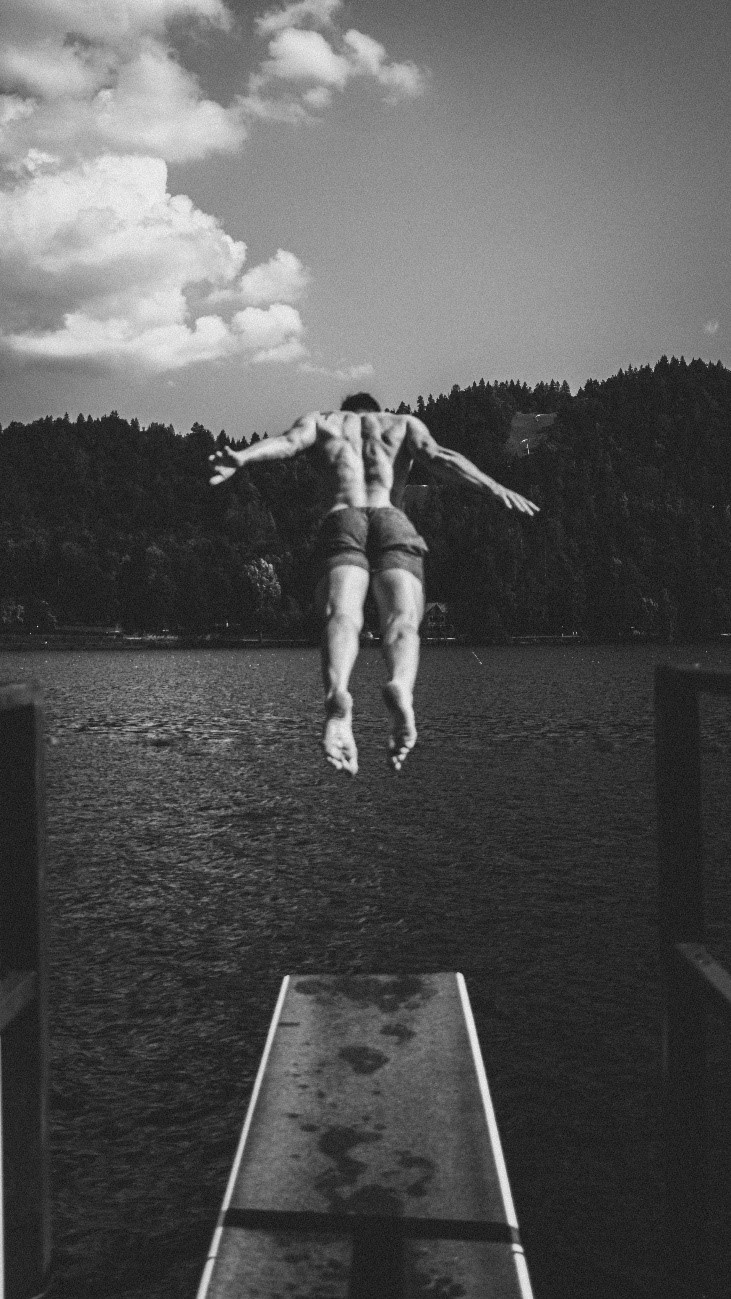 Man Jumping into Sea for Swim