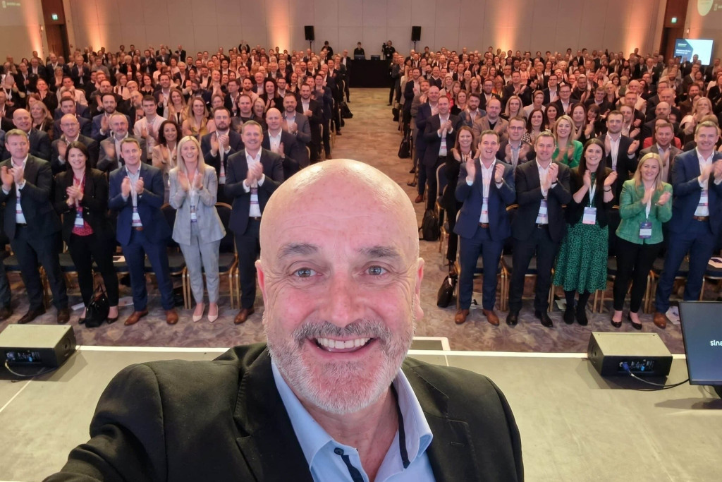 Enda O’Doherty speaking to a large corporate audience